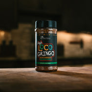 Ray's Loco Gringo Southwest Seasoning in bottle with faded kitchen background behind.