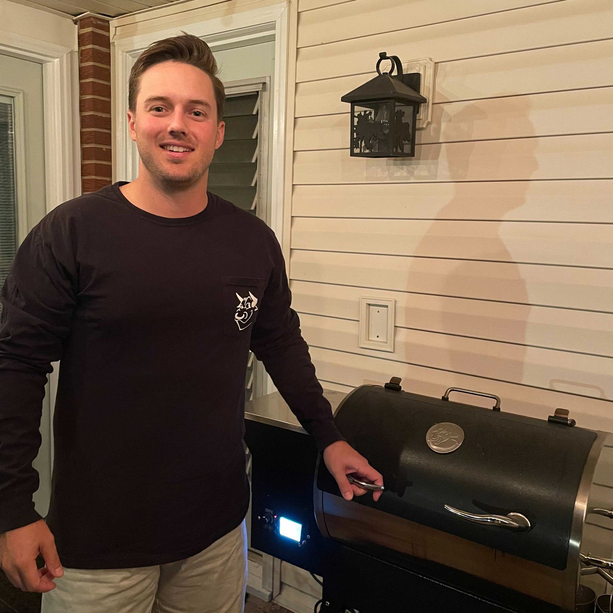 recteq customer service representative, David Hemann, at home on his deck cooking on his RT-340 wood pellet grill. 