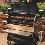 The RT-2500 BFG Wood Pellet Grill with 3 racks filled with ribeyes. 