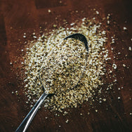 Colden's Freakin' Greek Rub on spoon showing the spice out of bottle.