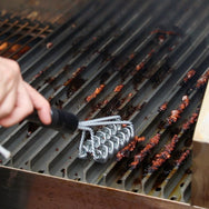 Grate Brush in use on the recteq wood pellet grill.