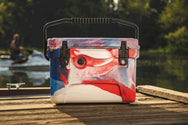 20 qt Red, White, and Blue RECTEQ ICER on a dock with handle up